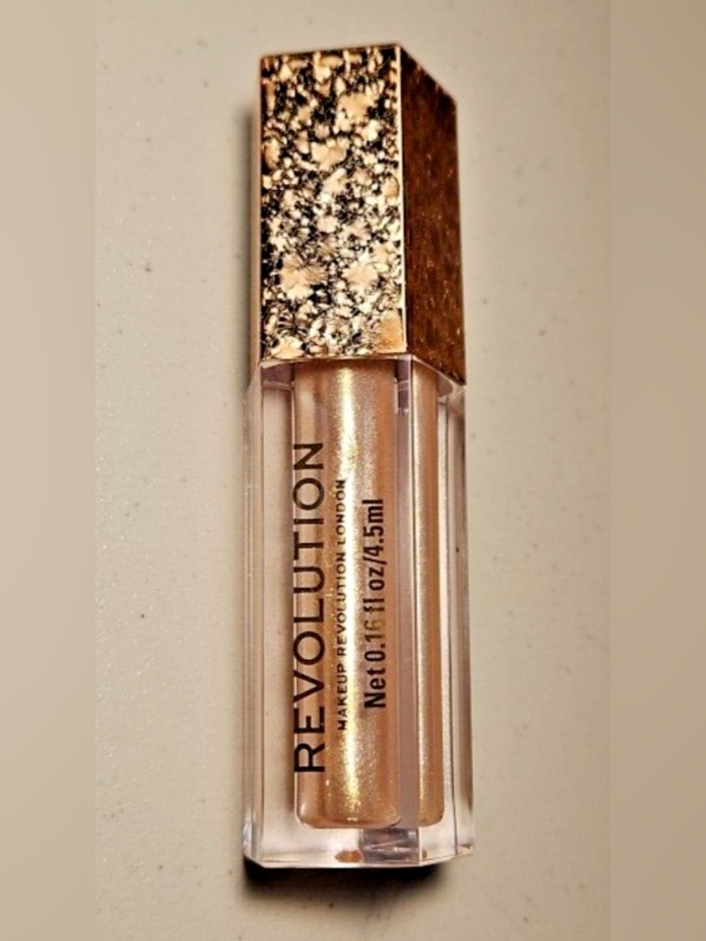 3/30$ Revolution Beauty Lip Topper : Luxurious shade Shimmering Gold